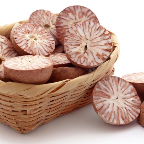 Betel nuts in a basket over white background