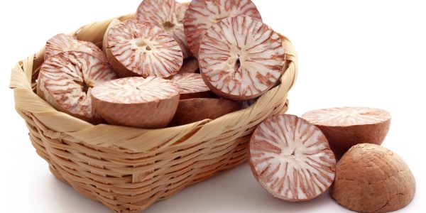 Betel nuts in a basket over white background